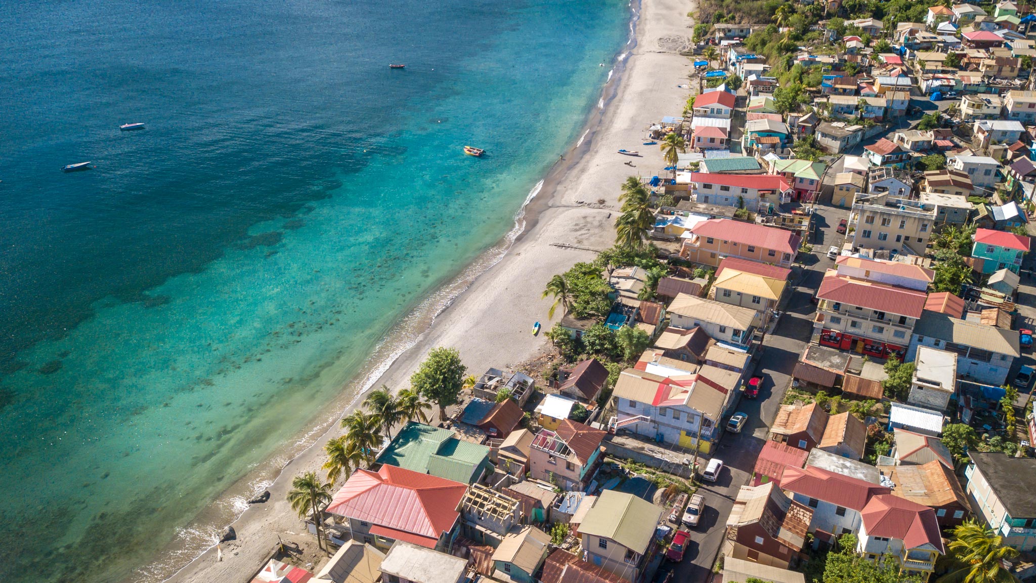 Aerial view of St Josephs on Dominicas west coast with a small town alongside it