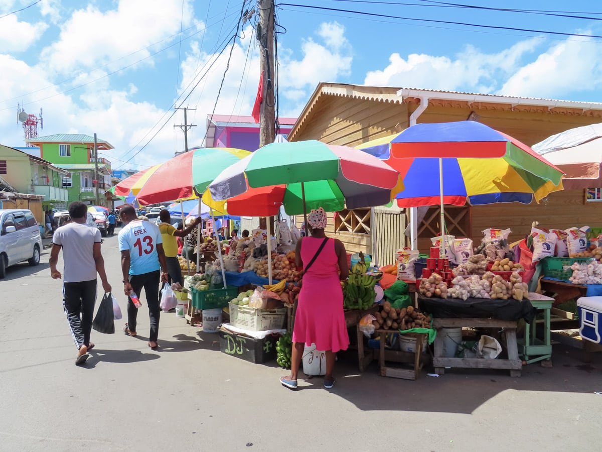 Stock up on fresh fruits and cheerful chats at Roseau's Market