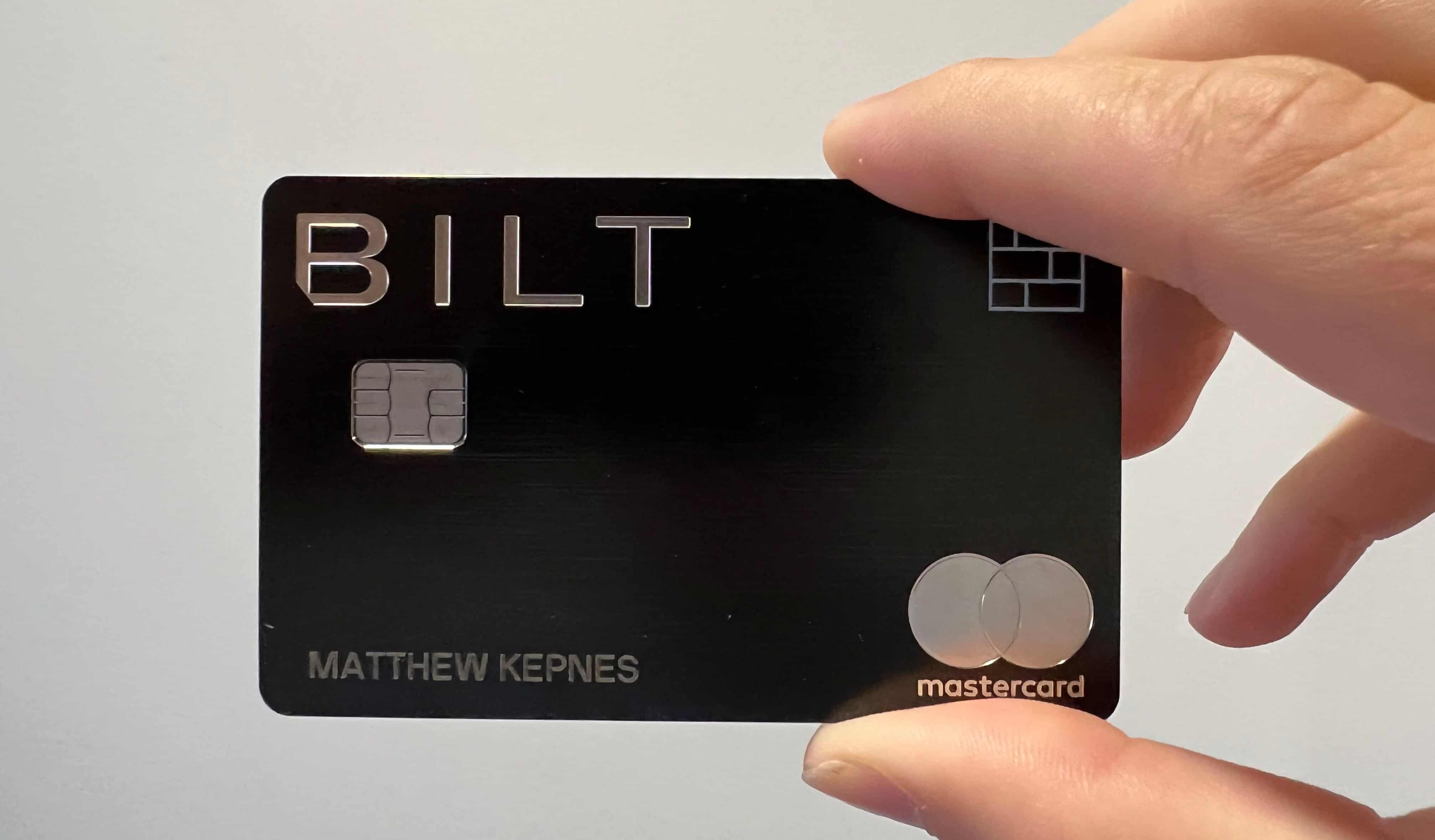 Nomadic Matt's Bilt Mastercard being held up in front of a white wall