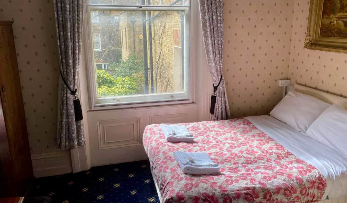 A small bed in a small hotel room at the Oakley Hotel in London, England